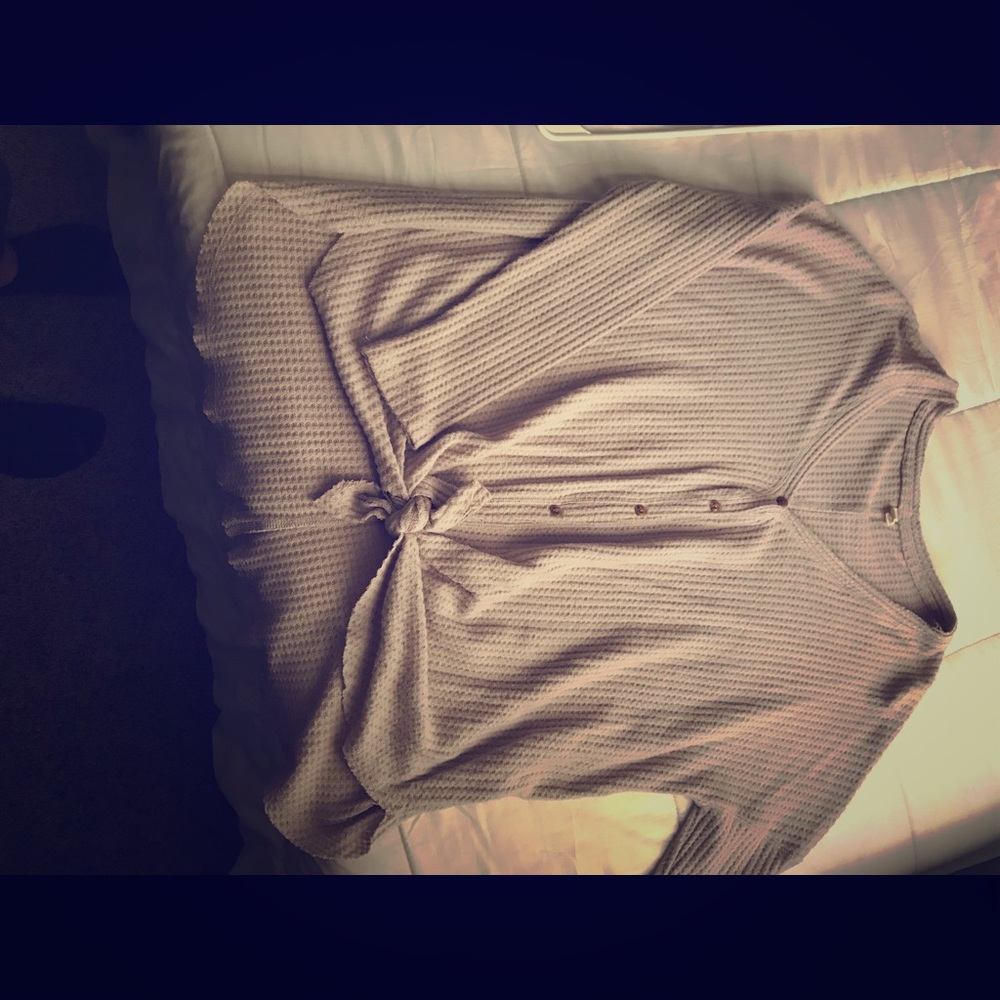Gray tunic with tie in front.